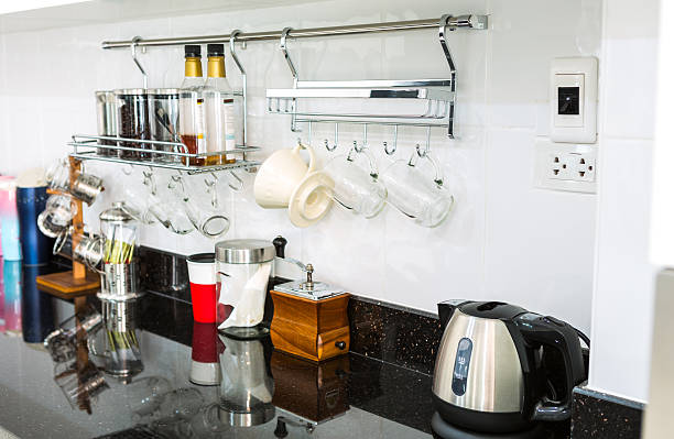 istock Kitchen cabinets with coffee corner in modern home living room. 493539893