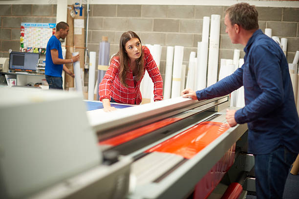 istock woman working at a signage company 493539976