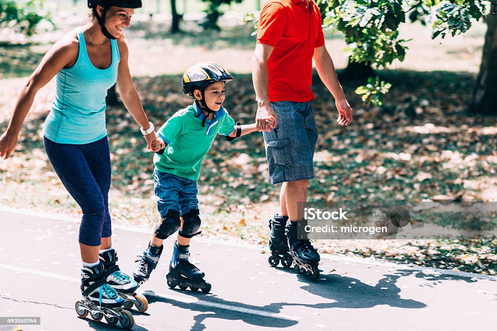 Beautiful family on roller blades Beautiful family on roller blades, spending quality time together Inline Skate Stock Photo