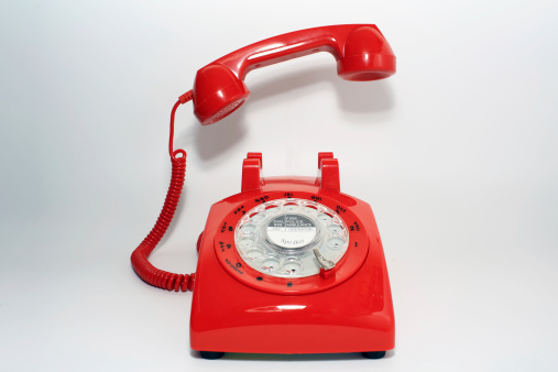 retro old fashion rotary dial phone pick up by hollow man
