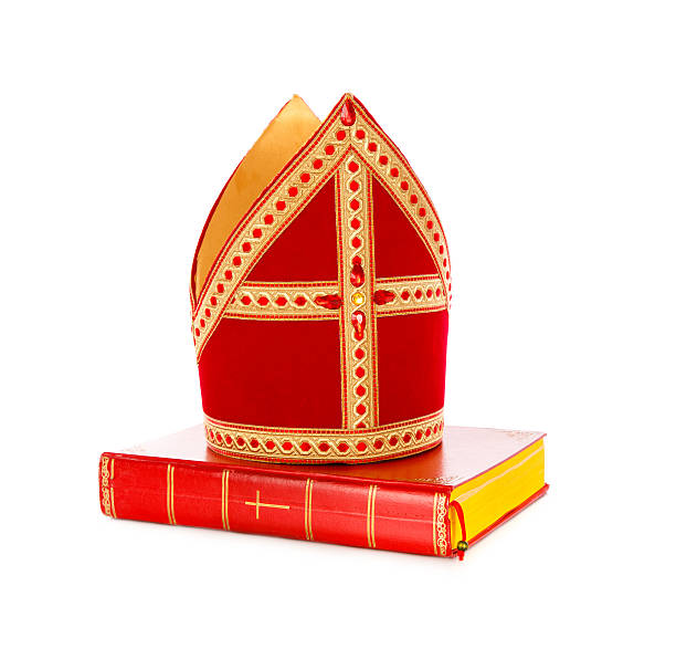 Mijter and book of sinterklaas Mitre or mijter and book of Sinterklaas. Isolated on white backgroud. Part of a dutch santa tradition mijter stock pictures, royalty-free photos & images