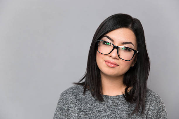istock Beautiful woman in glasses looking at camera 493541226