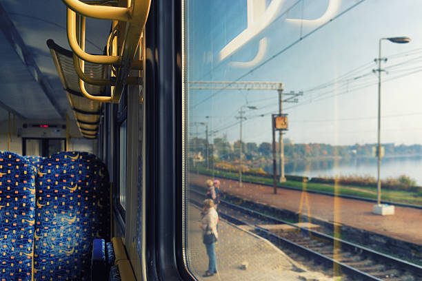 istock Window wagon train at the railway station with reflection 493547734