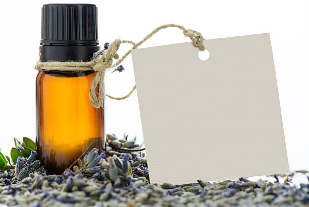 istock Essential oil, empty tags and lavender flowers 493547892