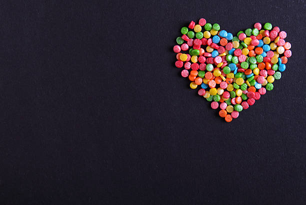istock colored confetti Powder for cake on a black background 493548006
