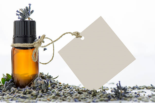 istock Essential oil, empty tags and lavender flowers 493548040
