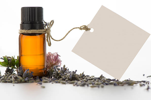 istock Essential oil, empty tags and lavender flowers 493548180
