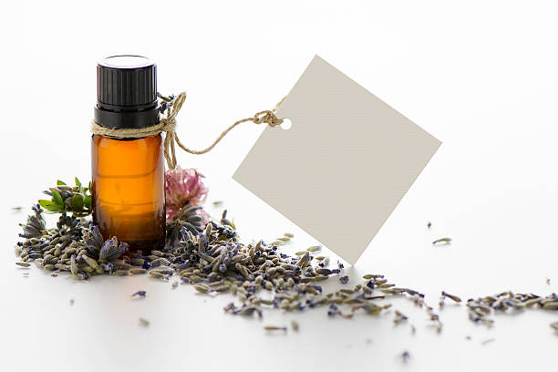istock Essential oil, empty tags and lavender flowers 493548274