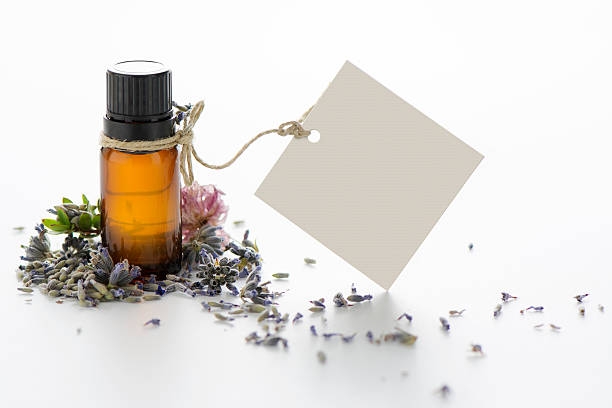 istock Essential oil, empty tags and lavender flowers 493548384