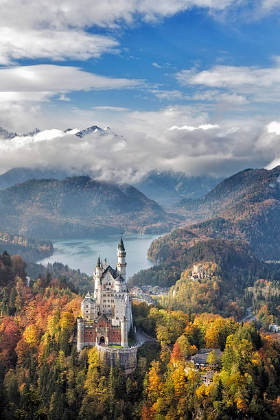 Neuschwanstein Castle, Germany Hohenschwangau, Germany - October 17, 2015: view of Neuschwanstein Castle on october 17th near Hohenschwangau, Germany during autumn afternoon surrounded by fall colours allgau stock pictures, royalty-free photos & images