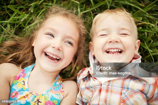 Sister And Brother Kids Laughing Top View Stock Photo - Download Image Now - Child, Laughing, Teenager