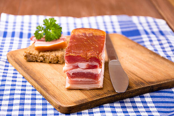 istock Smoked bacon on a wooden board 493552226