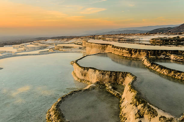 istock Pamukkale, Carbonate travertines the natural pools during sunset. 493553280