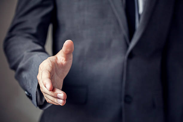 istock Businessman in suit ready to handshake with trust and professionalism 493553858