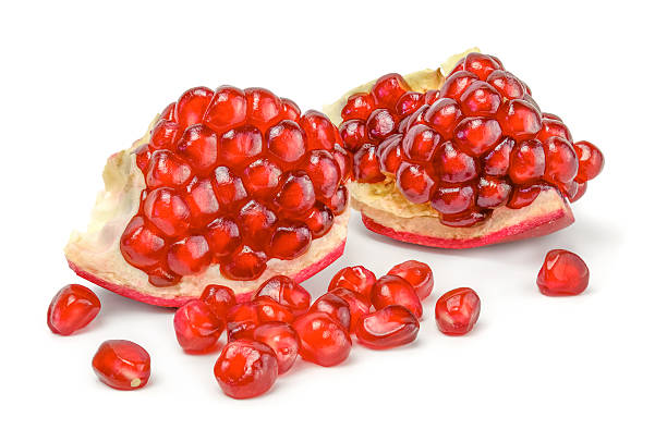 istock Juicy pieces of Pomegranate on white background cutout 493555266