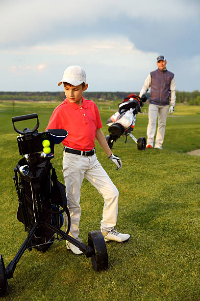 Father with son at golf stock photo