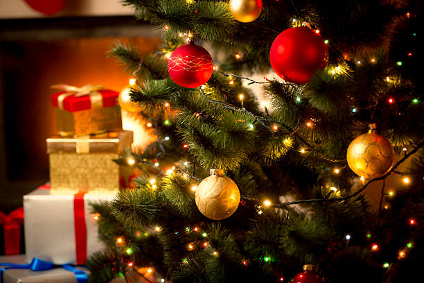 background with illuminated fir tree and fireplace at house