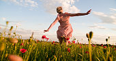 Woman Running In The Poppy Meadow