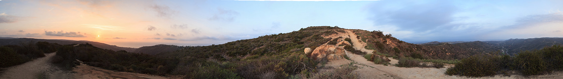 Panoramic 360-degree view of the sunset from the top of the hiking trail at Alta Laguna Park, “Top of the World”, overlooking the saddleback mountains in Laguna Beach, Southern California