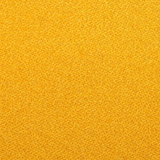 istock Seamless yellow colored fabric-textured background 493561366