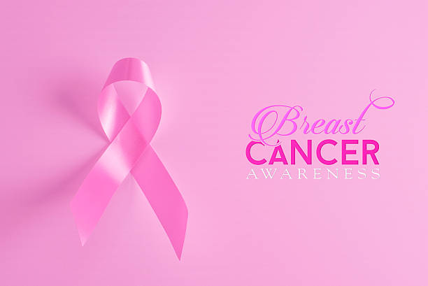 乳がん撲滅協賛ピンクのリボンの背景 - breast cancer women breast cancer awareness ribbon pink ストックフォトと画像