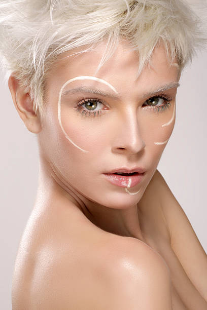 istock beautiful blond model wearing elegant artistic makeup 493561912