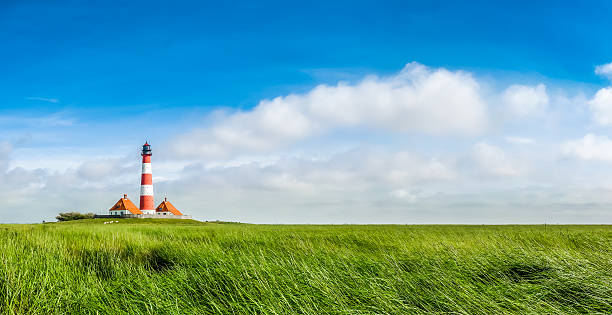 istock Famous Westerheversand lighthouse at North Sea, Schleswig-Holste 493563304
