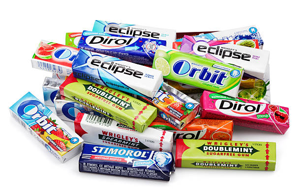Heap of various brand chewing or bubble gum Tula, Russia - April 28, 2014: Heap of various brand chewing or bubble gum including Orbit, Dirol, Eclipse, Stimorol, Wrigley Spearmint and Doublemint isolated on white with clipping path mint chewing gum stock pictures, royalty-free photos & images