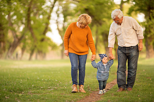 istock Taking first steps with grandma and grandpa 493564417