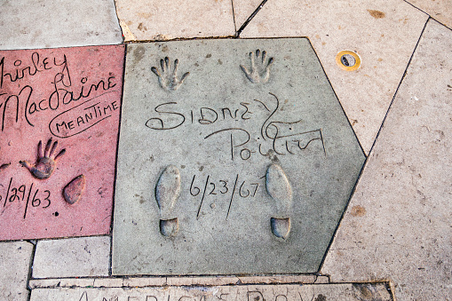 Los Angeles, USA - June 26, 2012: handprints of Sidney Poitier in Hollywood Boulevard in Los Angeles. There are nearly 200 celebrity handprints in the concrete of Chinese Theatre's forecourt.