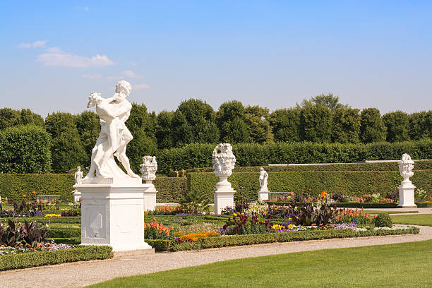 Great Garden, Herrenhausen, Hannover, Lower Saxony, Germany Hannover, Germany - July 23, 2013: White sculptures in Great Garden. The Great Garden of Herrenhausen Gardens, is unique garden grounds, laid out in a baroque style, are one of the most famous attractions in Hannover. They were sculpted in 1699 on the request of princess Sophie. The gardens are a heritage of the Kings of Hannover and they have always been one of the most distinguished baroque formal gardens of Europe. The gardens are considered popular recreation areas for the residents of Hannover.The history of the gardens spans several centuries, and they remain a popular attraction to this day. knot garden stock pictures, royalty-free photos & images