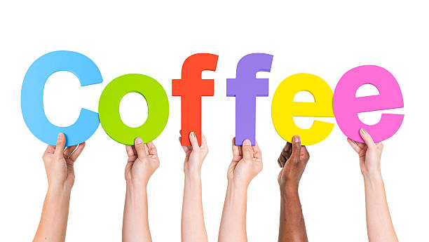 istock Multiethnic Arms Raised Holding Word Coffee 493565405