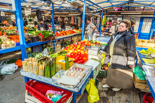 Krakow, Poland - May 5, 2014: people sell their goods at the market Stary Kleparz on May 5, 2014 in Krakow, Poland. The covered marketplace has a tradition over 800 years.