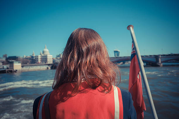 istock Woman relaxing on boat on the Thames 493565967