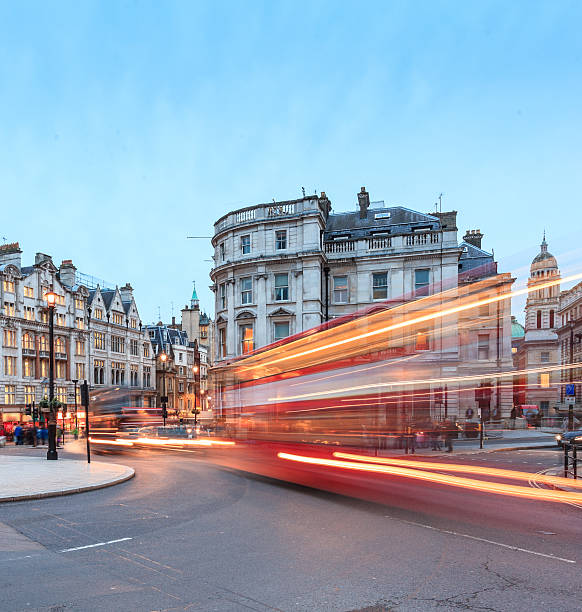 istock London, double-decker buses passing at Charing Cross junction 493566883