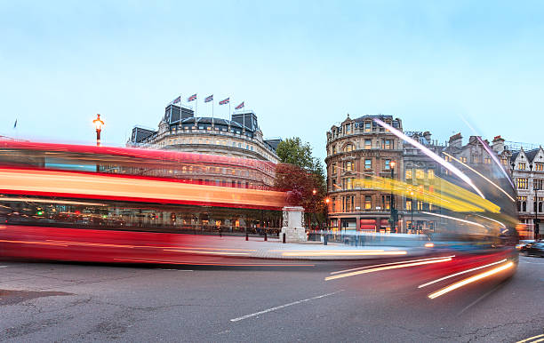 istock London, double-decker buses passing at Charing Cross junction 493566899