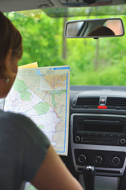 istock Young woman searching direction on the map 493566967