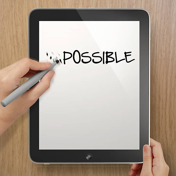istock hand changing the word impossible to possible with stylus eraser 493568489