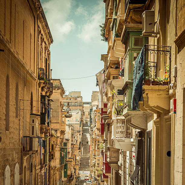 typical narrow street with stairs in the city Valetta on the island of Malta