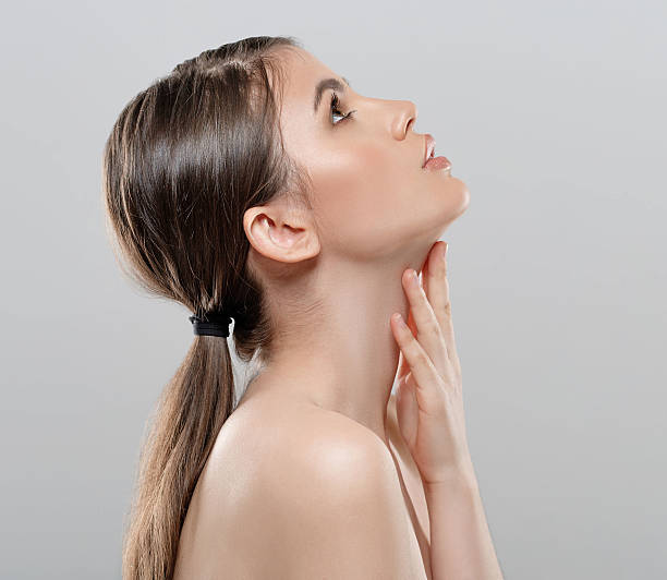 istock Beautiful woman face close up studio white sexy lips 493573462