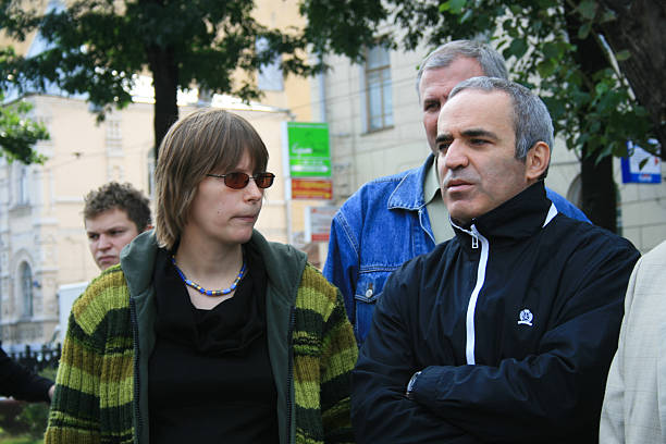 Policies Marina Litvinovich and Garry Kasparov Moscow, Russia - September 3, 2008. Policies Marina Litvinovich and Garry Kasparov. Memorial meeting on the anniversary of the terrorist attack in Beslan, when militants from the Caucasus took children hostage at the school. The Moscow rally organized by the opposition and human rights activists. north caucasus photos stock pictures, royalty-free photos & images