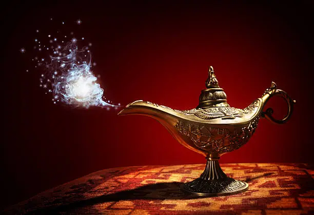 Magic lamp with Genie appearing in blue smoke concept for wishing, luck and magic