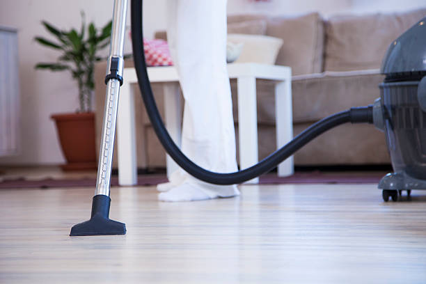 istock Woman with Vacuum Cleaner 493575330