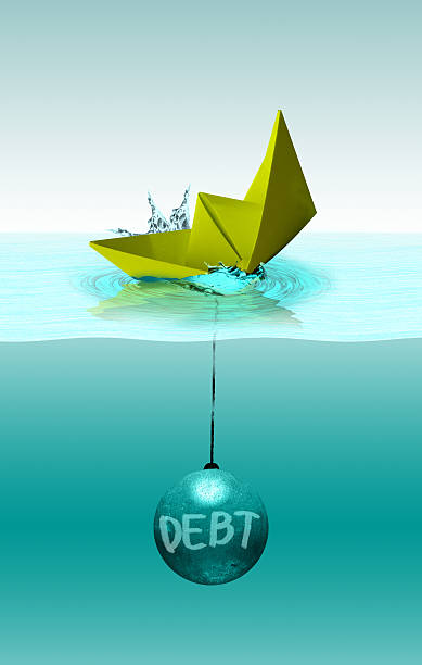 istock Crisis concept, sinking paper ship with wrecking ball 493576368