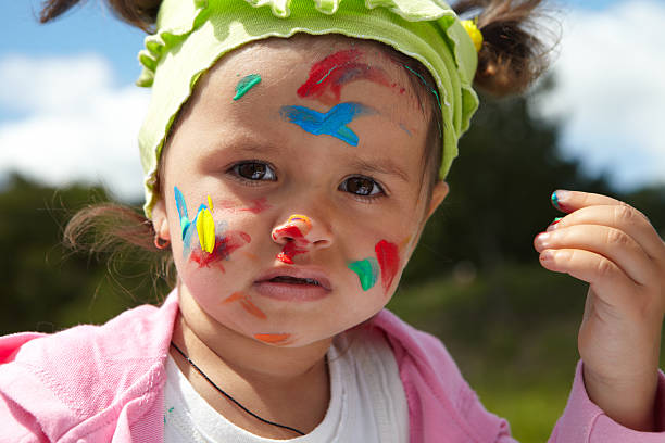 istock Little girl draws paints 493576612