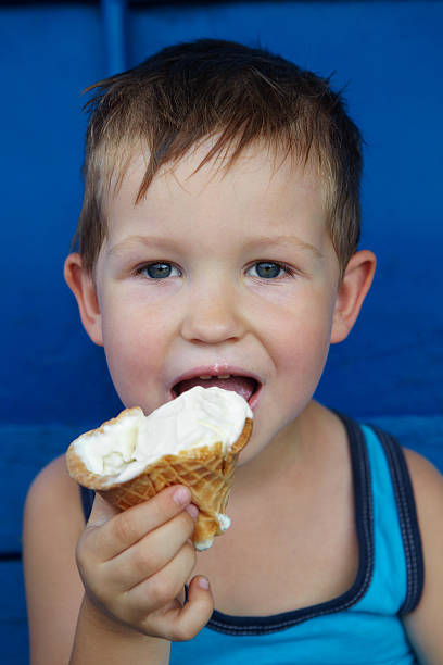 istock Little boy eating ice cream 493576994