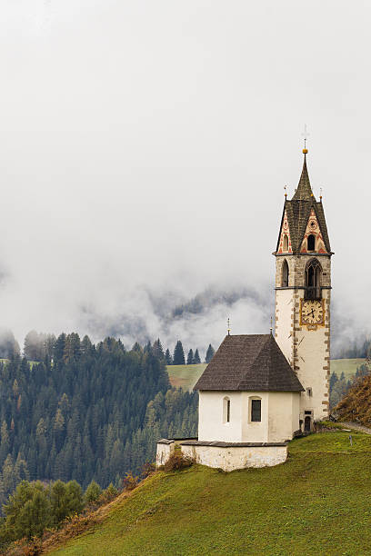 istock Romantic church in fog 493577380