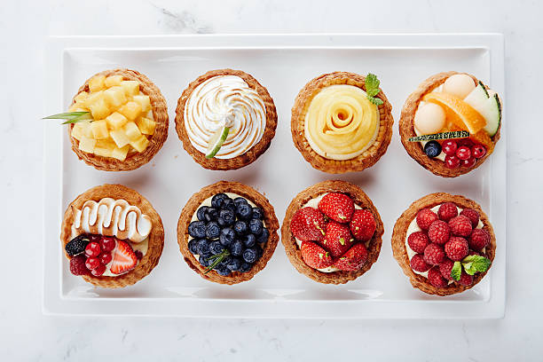 Close up of fruit tarts and various desserts