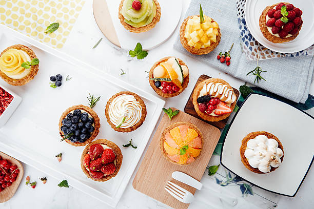 istock Close up of fruit tarts and various desserts 493579252