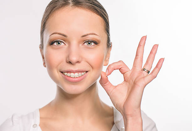 istock Young woman with teeth braces 493581364